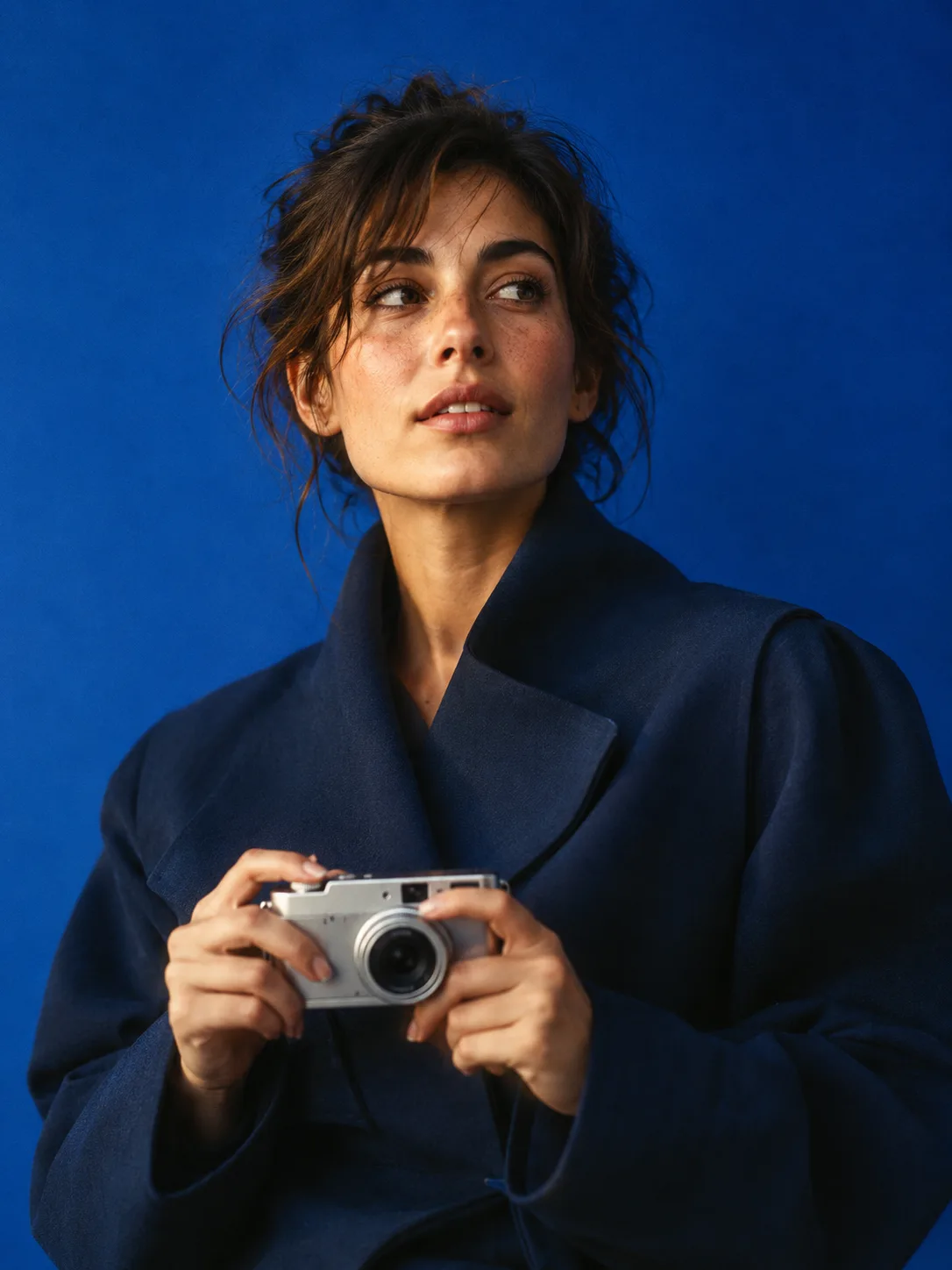 Generated editorial portrait of a creative director in a blue studio
